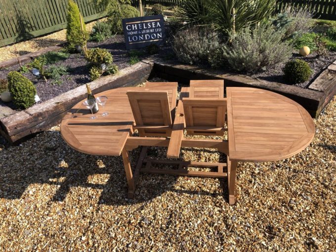 Teak extending table with 8 stacking chairs